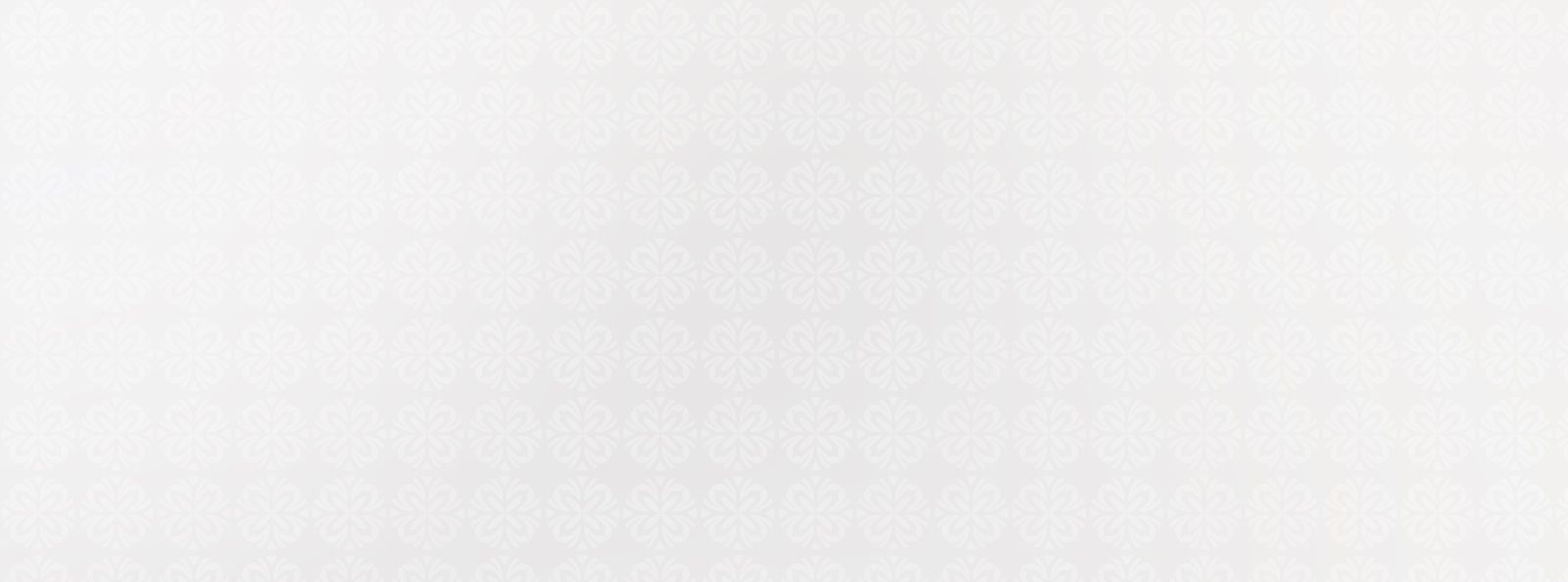 Light floral patterned background in subtle tones.